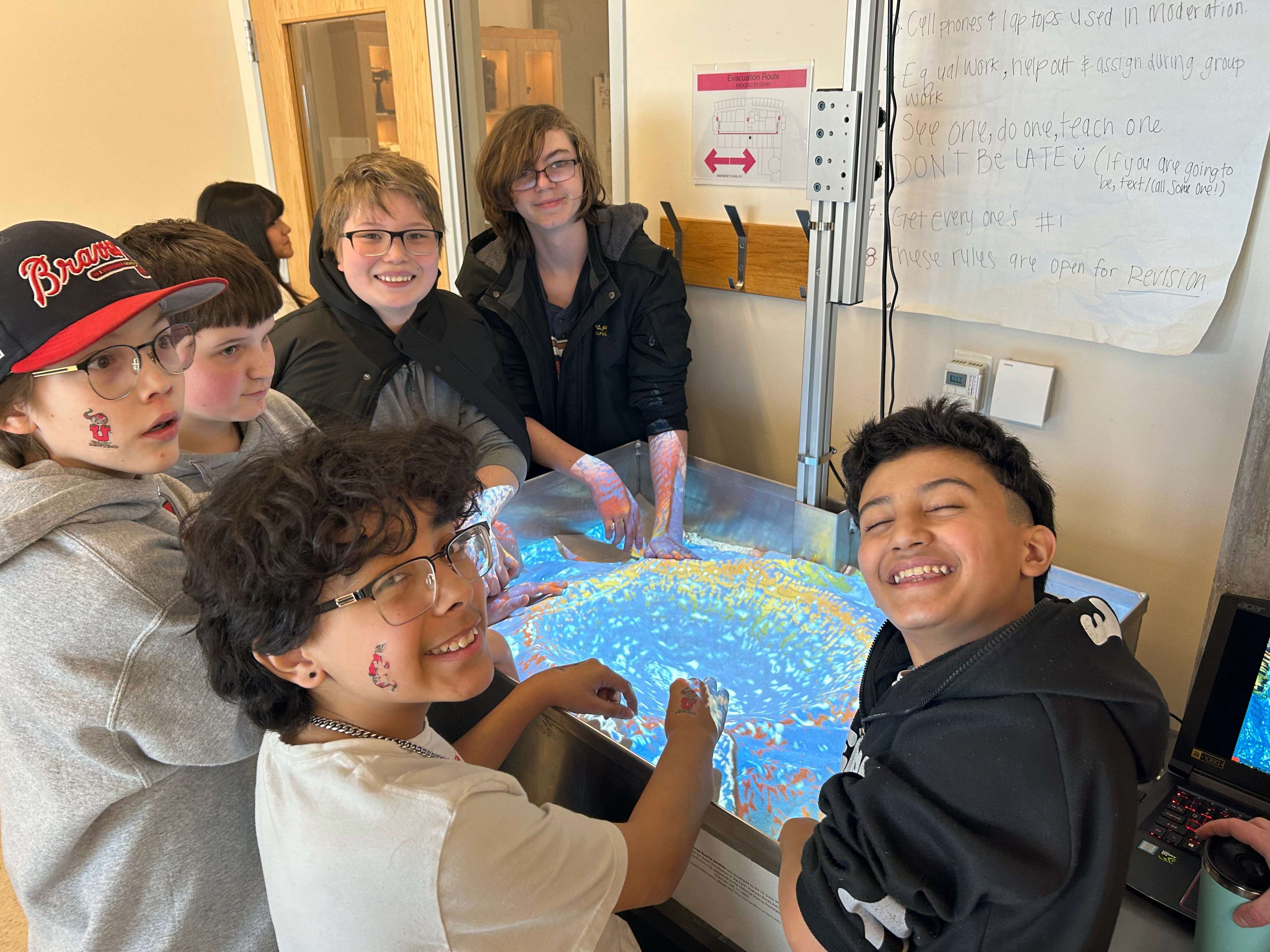 Middle School Students using the sand box